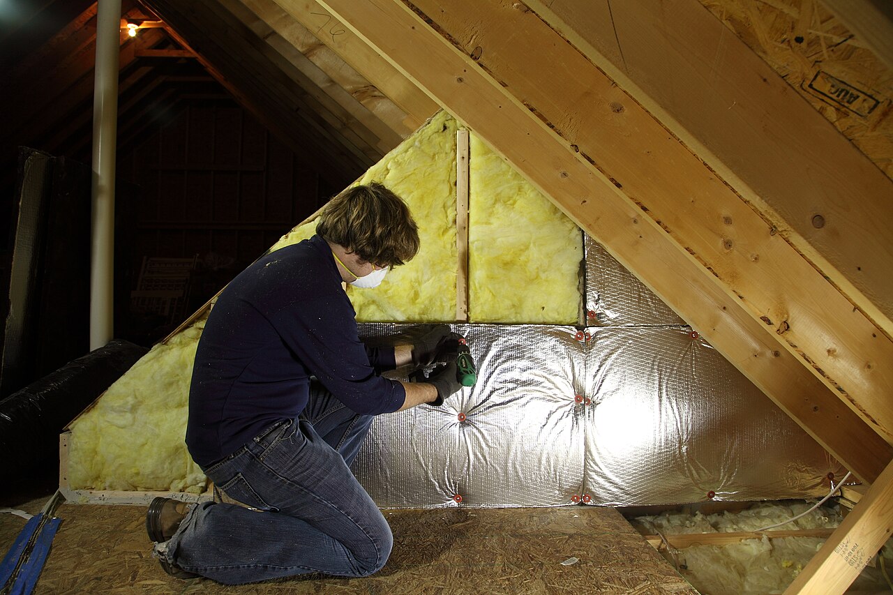 Attic insulation of the kind cleaned and replaced after a rodent infestation