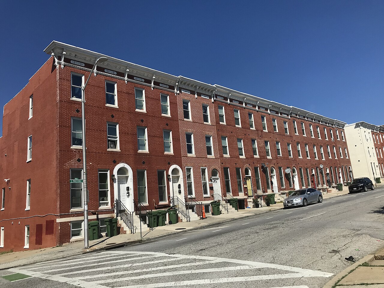 Brick Baltimore rowhouses, the setting for rodent-proofing work